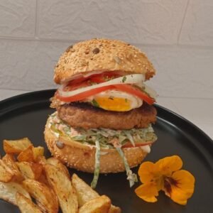 Delicious wholesome burger with Apple sour cream coleslaw and easy over egg