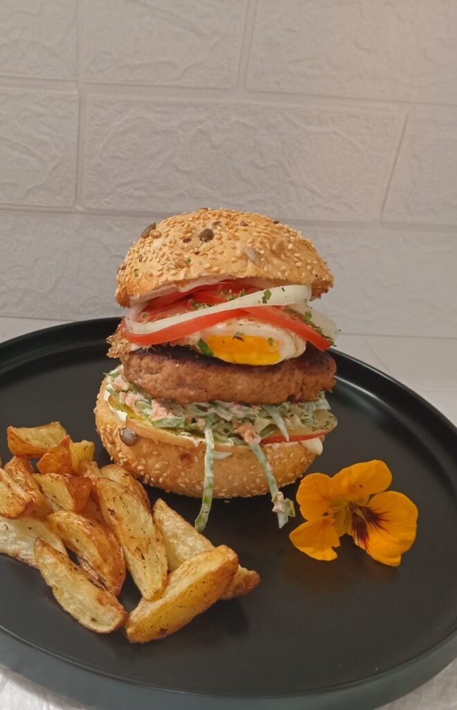 Delicious wholesome burger with Apple sour cream coleslaw and easy over egg